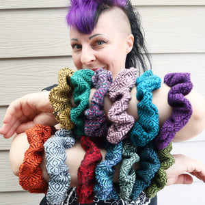 girl with purple and black mohawk wearing lots of handwoven hair scrunchies