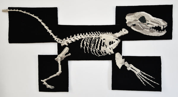 Handwoven tapestry artwork made up on skeletons of various animals