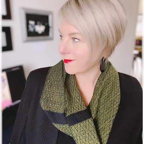 Deborah Gates wearing a handwoven cotton cravat in olive green and black