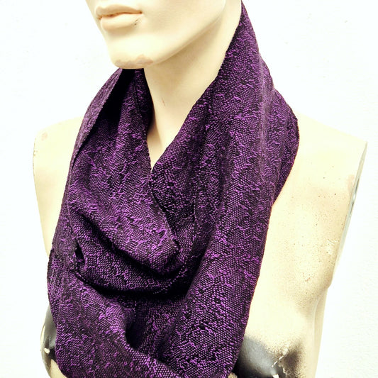 Purple fine handwoven scarf on a mannequin with a white background