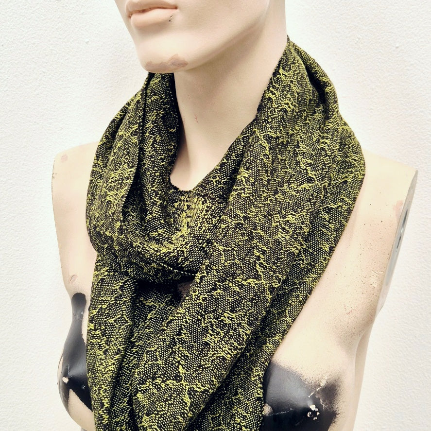 mannequin wearing fine handwoven cotton scarf in bright lime green and black