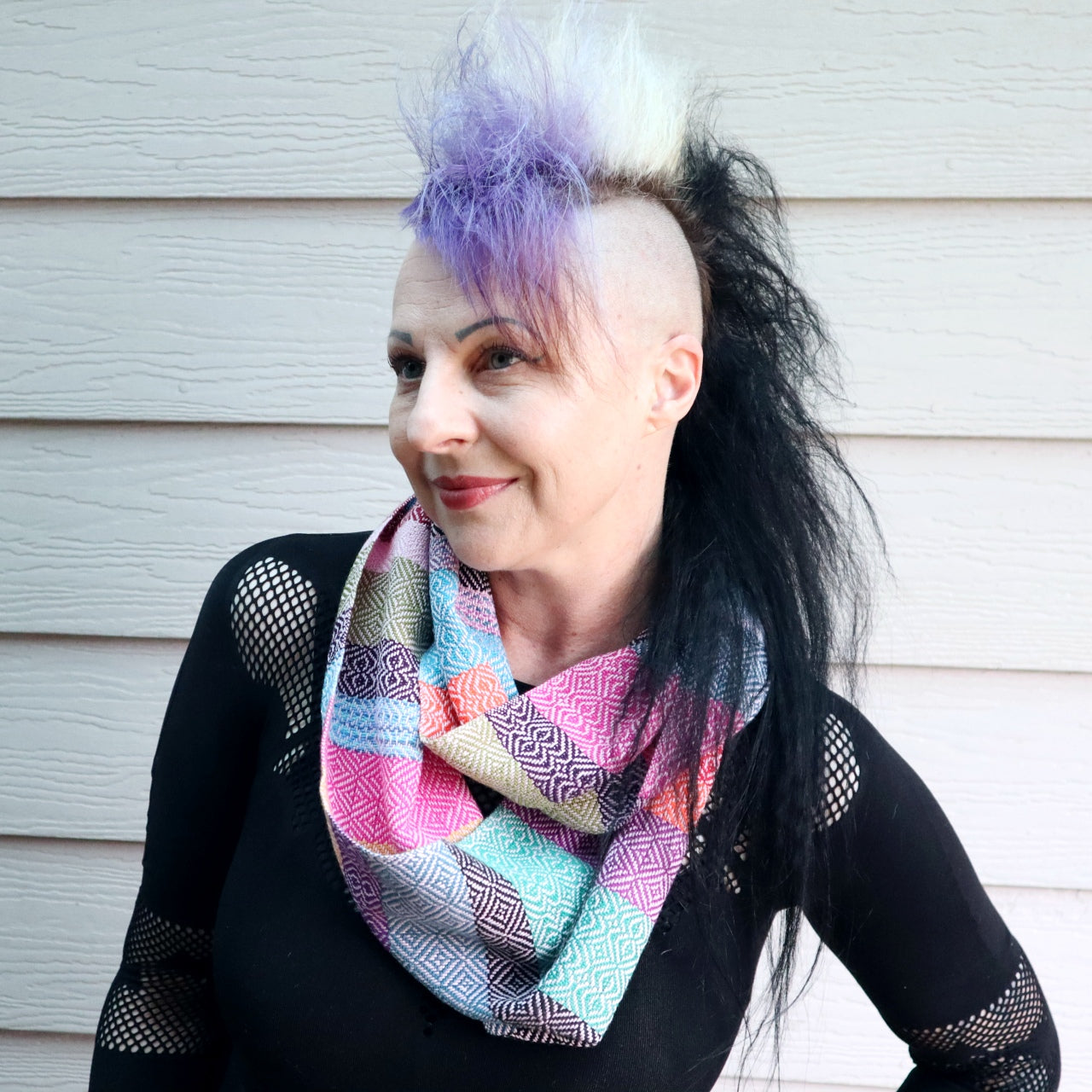 Michelle wearing a handwoven multi coloured infinity scarf
