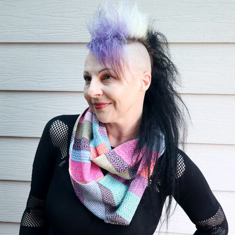 Michelle wearing a handwoven multi coloured infinity scarf