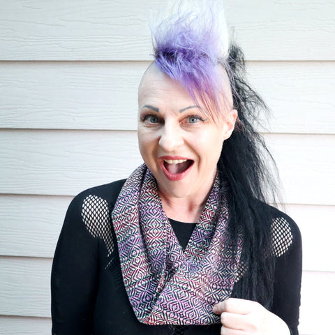 Michelle wearing a short handwoven infinity scarf in multi colours