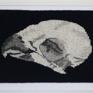 hand woven tapestry of parrot skull