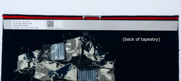back of hand woven tapestry, showing the batten and hanging mechanism
