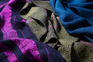 beautiful luxury handwoven textiles in pink, black, olive green, blue