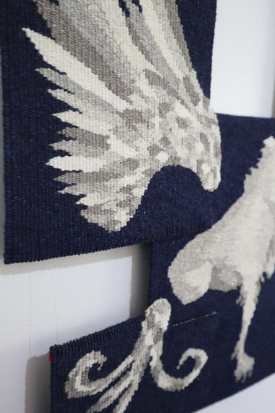 detail of unique tapestry based on a mythical griffin